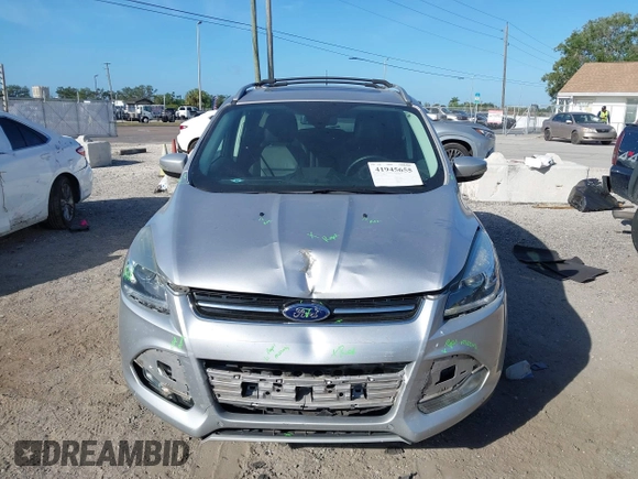 2016 Ford Escape Titanium with VIN 1FMCU0J94GUB11776, listed as a IAAI auction lot 41945655 with 119,949 mi miles. Bid and sale history available at carsss.com. Image 12.