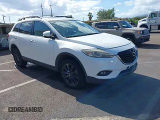 2015 Mazda CX-9 Grand Touring with VIN JM3TB2DA7F0456065, listed as a IAAI auction lot 42328501 with 116,951 mi miles and . Bid and sale history available at DreamBid. Image 1.