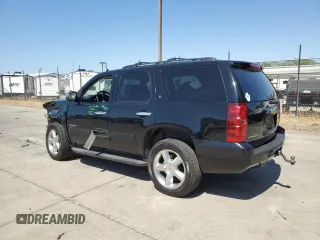 2014 Chevrolet Tahoe LT with VIN 1GNSCBE07ER115998, listed as a Copart auction lot 59577485 with 154,486 mi miles and Salvage title. Bid and sale history available at DreamBid. Image 2.