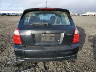 2005 Kia Spectra with VIN KNAFE161655093051, listed as a Copart auction lot 77821904 with 104,874 mi miles and Salvage Title. Bid and sale history available at carsss.com. Image 6.