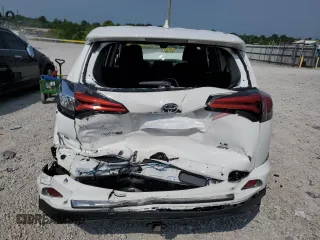 2018 Toyota RAV4 LE with VIN 2T3BFREV2JW780824, listed as a Copart auction lot 60258635 with 59,030 mi miles and Salvage title. Bid and sale history available at DreamBid. Image 6.