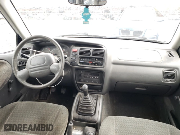 2004 Suzuki Vitara z VIN 2S3TD62VX46100019, wystawiony jako Copart lot #74291684 z przebiegiem 148 566 mil mil oraz Szkoda całkowita • Salvage title. Historia ofert i sprzedaży dostępna na DreamBid. Obrazek 8.
