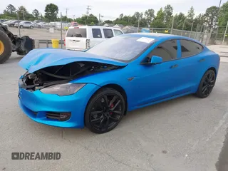 2013 Tesla Model S Performance with VIN 5YJSA1DP5DFP25345, listed as a IAAI auction lot 42288379 with 165,915 mi miles and . Bid and sale history available at DreamBid. Image 2.