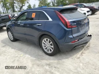 2022 Cadillac XT4 FWD Luxury z VIN 1GYAZAR47NF120348, wystawiony jako Copart lot #50187025 z przebiegiem 76 886 mil mil oraz Nie do naprawy • Non repairable. Historia ofert i sprzedaży dostępna na DreamBid. Obrazek 2.
