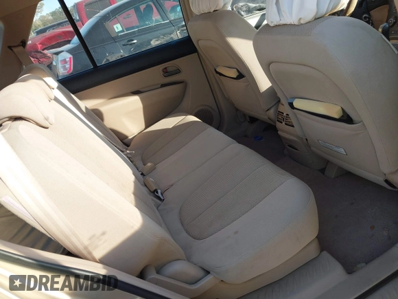 2007 Kia Rondo LX with VIN KNAFG526977114033, listed as a IAAI auction lot 40967531 with 126,761 mi miles. Bid and sale history available at carsss.com. Image 8.