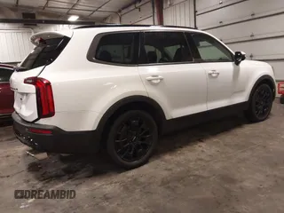 2022 Kia Telluride EX z VIN 5XYP3DHC2NG201167, wystawiony jako IAAI lot #42572806 z przebiegiem 67 409 mil mil oraz . Historia ofert i sprzedaży dostępna na DreamBid. Obrazek 4.