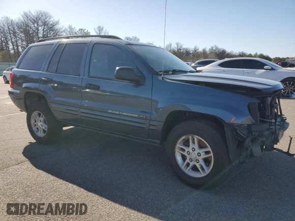 2004 Jeep Grand Cherokee Laredo z VIN 1J4GW48S74C159381, wystawiony jako Copart lot #53972115 z przebiegiem 128 309 mil mil oraz Szkoda całkowita • Salvage title. Historia ofert i sprzedaży dostępna na DreamBid. Obrazek 4.