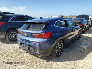 2021 BMW X2 sDrive28i with VIN WBXYH9C02M5S54591, listed as a Copart auction lot 77223834 with 0 mi miles and Salvage Title. Bid and sale history available at carsss.com. Image 3.