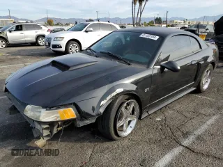 2001 Ford Mustang GT Deluxe with VIN 1FAFP42X71F163143, listed as a Copart auction lot 81133184 with 132,716 mi miles and Salvage Title. Bid and sale history available at carsss.com. Image 1.