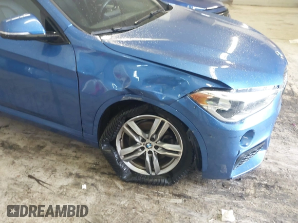 2019 BMW X1 xDrive28i with VIN WBXHT3C53K5L36690, listed as a IAAI auction lot 42012992 with 70,339 mi miles. Bid and sale history available at carsss.com. Image 6.