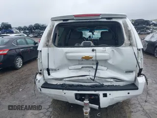 2014 Chevrolet Suburban LT with VIN 1GNSCJE06ER154639, listed as a IAAI auction lot 41410623 with 213,592 mi miles. Bid and sale history available at carsss.com. Image 16.