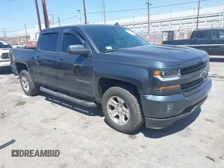 2018 Chevrolet Silverado 1500 LT with VIN 3GCUKREC1JG511846, listed as a IAAI auction lot 42024170 with 121,532 mi miles and . Bid and sale history available at DreamBid. Image 1.