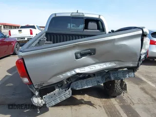 2018 Toyota Tacoma SR5 with VIN 3TMAZ5CN0JM053861, listed as a IAAI auction lot 41920377 with 104,015 mi miles and . Bid and sale history available at DreamBid. Image 6.