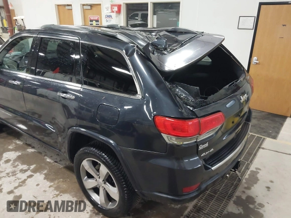 2014 Jeep Grand Cherokee Overland with VIN 1C4RJFCT9EC234270, listed as a IAAI auction lot 41938621 with 144,541 mi miles and . Bid and sale history available at DreamBid. Image 6.