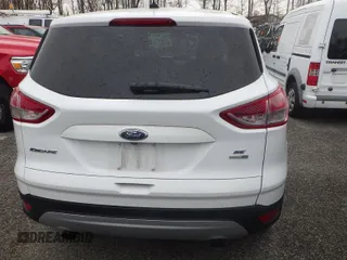 2016 Ford Escape SE z VIN 1FMCU9GX9GUC30370, wystawiony jako IAAI lot #42325145 z przebiegiem 101 531 mil mil oraz . Historia ofert i sprzedaży dostępna na DreamBid. Obrazek 1.
