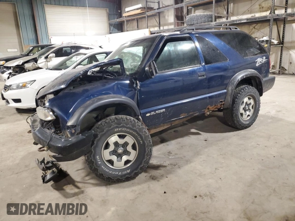 2001 Chevrolet Blazer LS z VIN 1GNCT18W01K143093, wystawiony jako Copart lot #82650514 z przebiegiem Nie podano mil oraz Szkoda całkowita • Salvage title. Historia ofert i sprzedaży dostępna na DreamBid. Obrazek 1.
