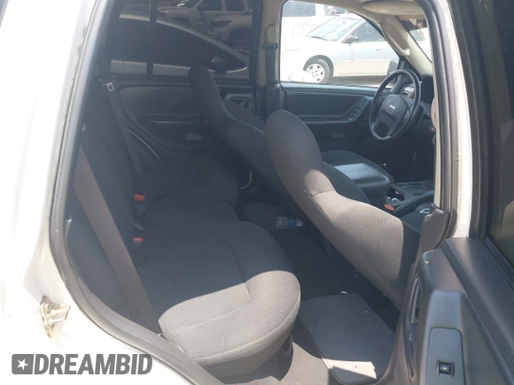 2003 Jeep Grand Cherokee Laredo with VIN 1J4GX48S63C546208, listed as a IAAI auction lot 42288811 with 141,696 mi miles and . Bid and sale history available at DreamBid. Image 8.