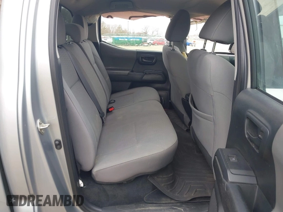 2018 Toyota Tacoma SR with VIN 3TMCZ5AN4JM130307, listed as a IAAI auction lot 41541477 with 74,369 mi miles and . Bid and sale history available at DreamBid. Image 8.