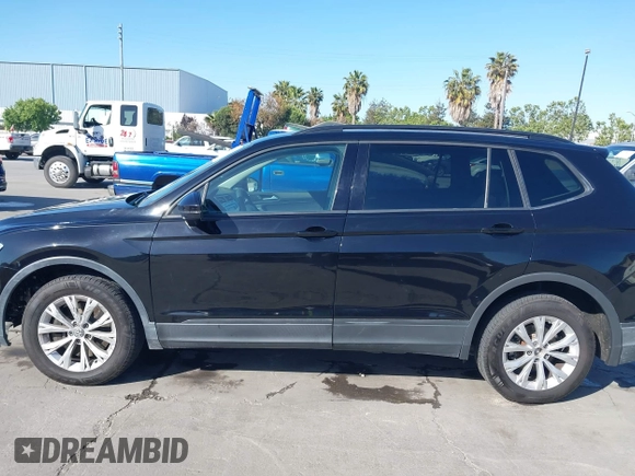 2018 Volkswagen Tiguan S with VIN 3VV1B7AX1JM091928, listed as a IAAI auction lot 42283454 with 53,650 mi miles and . Bid and sale history available at DreamBid. Image 14.