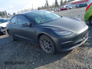 2019 Tesla Model 3 Mid Range z VIN 5YJ3E1EAXKF361861, wystawiony jako IAAI lot #41754025 z przebiegiem 198 399 mil mil oraz . Historia ofert i sprzedaży dostępna na DreamBid. Obrazek 1.