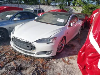 2016 Tesla Model S 90D with VIN 5YJSA1E21GF128460, listed as a IAAI auction lot 40733920 with 89,846 mi miles and . Bid and sale history available at DreamBid. Image 2.