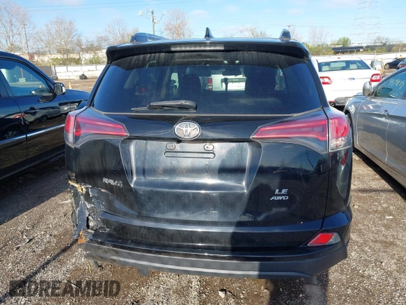 2018 Toyota RAV4 LE with VIN 2T3BFREV8JW706999, listed as a IAAI auction lot 41863485 with 115,589 mi miles. Bid and sale history available at carsss.com. Image 16.