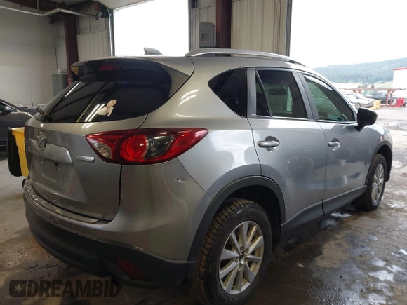 2015 Mazda CX-5 Sport z VIN JM3KE2BE8F0434889, wystawiony jako IAAI lot #42259894 z przebiegiem 298 835 mil mil oraz . Historia ofert i sprzedaży dostępna na DreamBid. Obrazek 4.