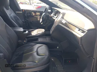 2014 Tesla Model S P85D with VIN 5YJSA1H25EFP65571, listed as a IAAI auction lot 42185442 with 115,990 mi miles and . Bid and sale history available at DreamBid. Image 5.