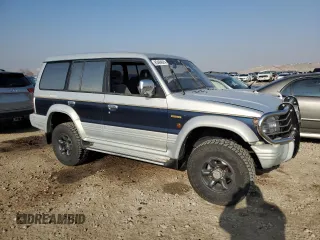1995 Mitsubishi Montero z VIN V464049505, wystawiony jako Copart lot #83484024 z przebiegiem 158 151 mil mil oraz Szkoda całkowita • Salvage title. Historia ofert i sprzedaży dostępna na DreamBid. Obrazek 4.