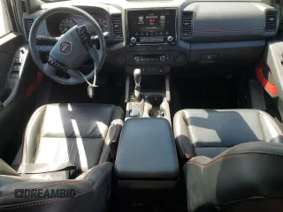 2023 Nissan Frontier SV with VIN 1N6ED1EJ3PN670640, listed as a Copart auction lot 58039525 with 15,302 mi miles and Salvage title. Bid and sale history available at DreamBid. Image 8.
