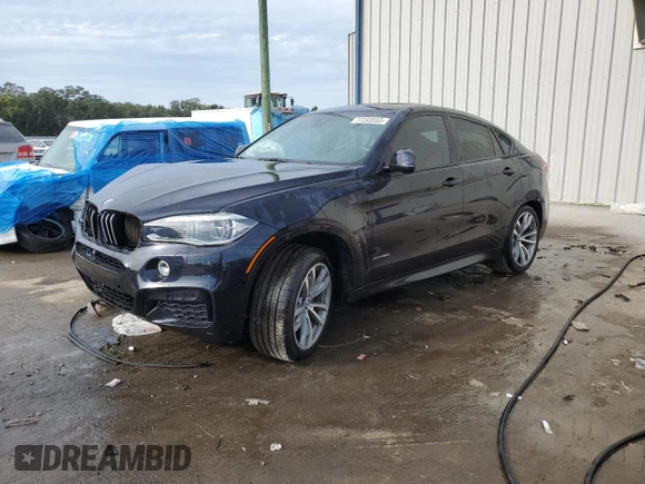 2015 BMW X6 xDrive50i with VIN 5UXKU6C56F0F93641, listed as a Copart auction lot 77233553 with 71,409 mi miles. Bid and sale history available at carsss.com. Image 1.