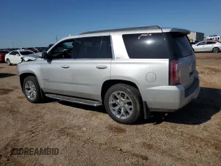 2017 GMC Yukon SLT with VIN 1GKS2BKC9HR345688, listed as a Copart auction lot 52303075 with 122,969 mi miles and Salvage Title. Bid and sale history available at carsss.com. Image 2.