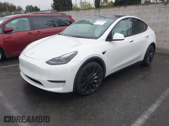 2021 Tesla Model Y Performance with VIN 5YJYGDEF2MF230374, listed as a IAAI auction lot 41708828 with 20,272 mi miles. Bid and sale history available at carsss.com. Image 2.