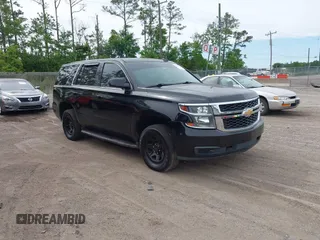 2018 Chevrolet Tahoe Commercial z VIN 1GNLCDEC5JR258811, wystawiony jako IAAI lot #42346094 z przebiegiem 107 374 mil mil oraz . Historia ofert i sprzedaży dostępna na DreamBid. Obrazek 1.