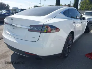 2014 Tesla Model S 60 with VIN 5YJSA1H15EFP46980, listed as a IAAI auction lot 41583672 with 61,080 mi miles and . Bid and sale history available at DreamBid. Image 4.