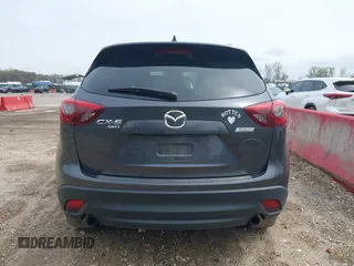 2016 Mazda CX-5 Grand Touring with VIN JM3KE4DYXG0830150, listed as a IAAI auction lot 41961007 with 142,570 mi miles and . Bid and sale history available at DreamBid. Image 16.