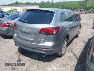 2015 Mazda CX-9 Touring with VIN JM3TB2CA2F0451180, listed as a IAAI auction lot 42180078 with 112,804 mi miles and . Bid and sale history available at carsss.com. Image 4.