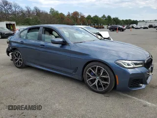 2023 BMW 5 Series M550i xDrive with VIN WBA13BK06PCM31937, listed as a Copart auction lot 66490494 with 24,972 mi miles and Salvage title. Bid and sale history available at DreamBid. Image 4.