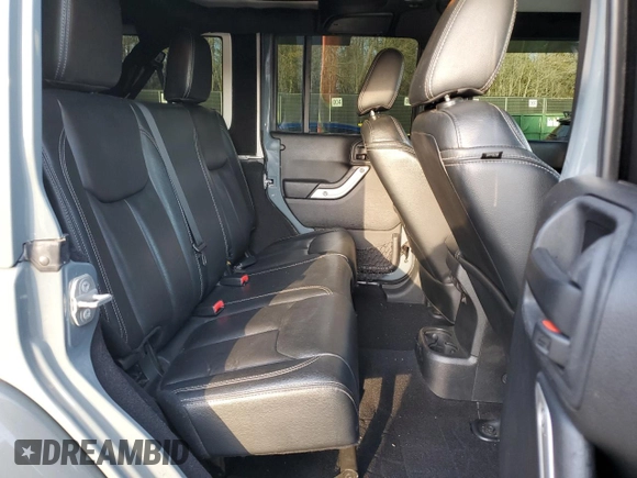 2015 Jeep Wrangler Unlimited Rubicon Hard Rock with VIN 1C4HJWFGXFL671660, listed as a Copart auction lot 82329074 with 214,579 mi miles and Salvage title. Bid and sale history available at DreamBid. Image 11.
