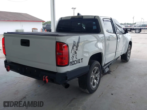 2020 Chevrolet Colorado 2WD Z71 with VIN 1GCGSDEN2L1159458, listed as a IAAI auction lot 42412924 with 90,011 mi miles and . Bid and sale history available at DreamBid. Image 4.
