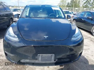 2022 Tesla Model Y Long Range with VIN 7SAYGDEEXNF459834, listed as a IAAI auction lot 42004576 with 56,175 mi miles and . Bid and sale history available at carsss.com. Image 12.
