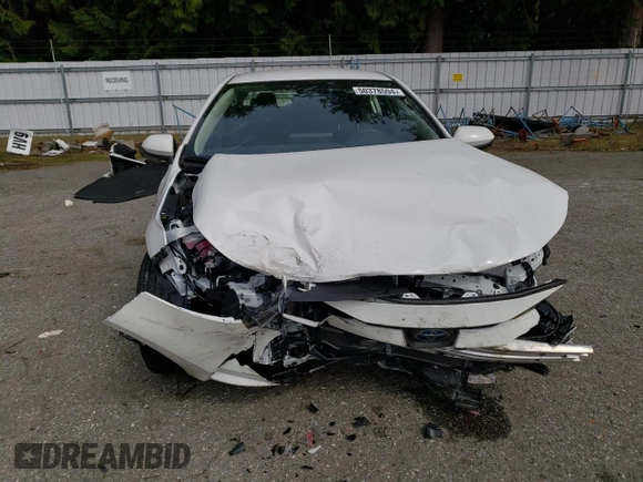 2023 Toyota Corolla Hybrid LE with VIN JTDBDMHE2PJ002549, listed as a Copart auction lot 50378594 with 5,028 mi miles and Salvage Title. Bid and sale history available at carsss.com. Image 5.