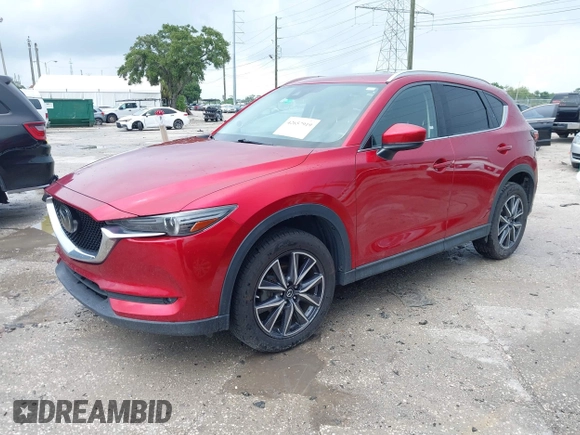 2018 Mazda CX-5 Grand Touring with VIN JM3KFADM5J0437365, listed as a IAAI auction lot 42657919 with 96,760 mi miles and . Bid and sale history available at DreamBid. Image 2.
