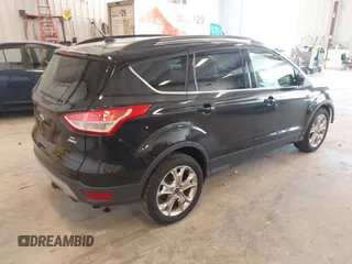 2014 Ford Escape SE with VIN 1FMCU9G95EUA16328, listed as a IAAI auction lot 42464235 with 108,570 mi miles and . Bid and sale history available at DreamBid. Image 4.