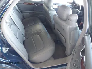 2004 Cadillac DeVille DTS z VIN 1G6KF57934U181654, wystawiony jako IAAI lot #41752298 z przebiegiem 131 861 mil mil oraz . Historia ofert i sprzedaży dostępna na DreamBid. Obrazek 8.