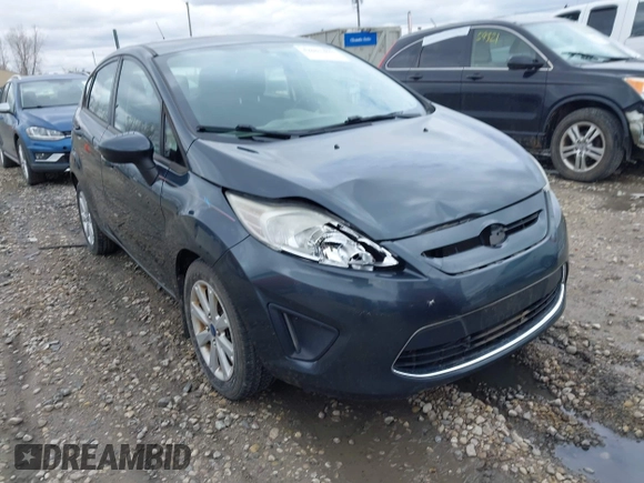 2011 Ford Fiesta SE with VIN 3FADP4EJ4BM228417, listed as a IAAI auction lot 42061494 with 86,873 mi miles. Bid and sale history available at carsss.com. Image 6.