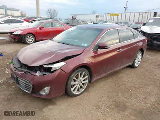2013 Toyota Avalon XLE with VIN 4T1BK1EB4DU029014, listed as a IAAI auction lot 41689404 with 130,297 mi miles. Bid and sale history available at carsss.com. Image 2.