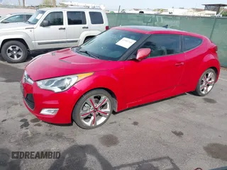 2013 Hyundai Veloster w/Black Int with VIN KMHTC6AD7DU117562, listed as a IAAI auction lot 41993745 with 106,780 mi miles. Bid and sale history available at carsss.com. Image 2.