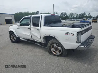 2000 Nissan Frontier XE with VIN 1N6ED27Y6YC334154, listed as a Copart auction lot 54140454 with 330,552 mi miles and Salvage title. Bid and sale history available at DreamBid. Image 2.