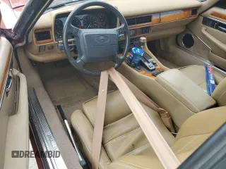1995 Jaguar XJS with VIN SAJNX2742SC197388, listed as a Copart auction lot 76579714 with 99,077 mi miles and Salvage Title. Bid and sale history available at carsss.com. Image 8.